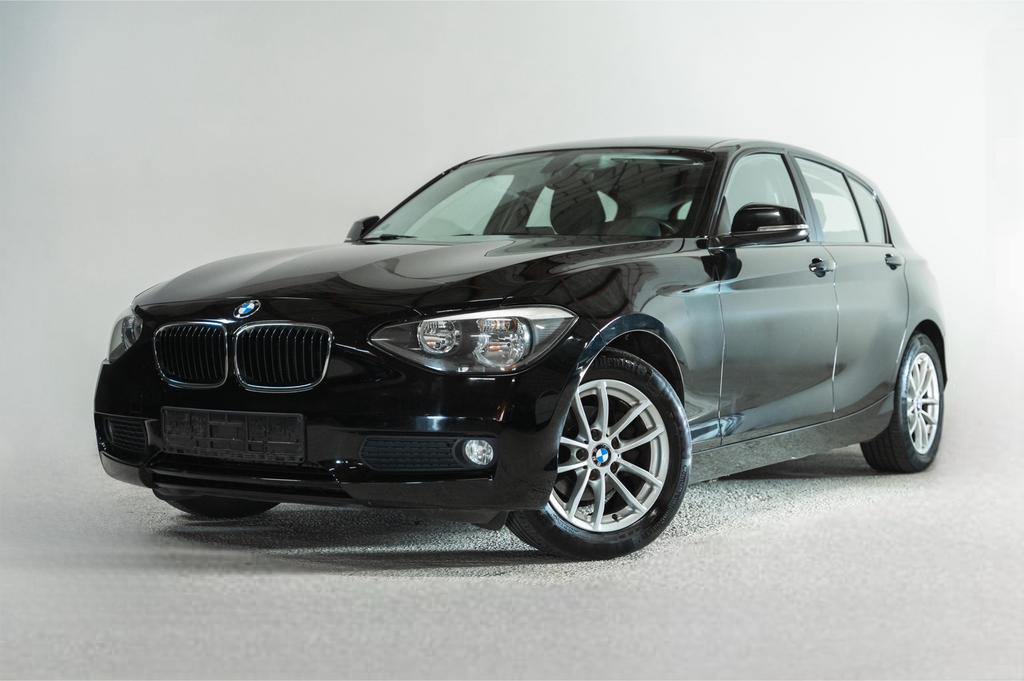 BMW 1-serie 116i Benzine 2012 Zwart, Auto's, BMW, 100 kW, Zwart, 4 cilinders, Zwart