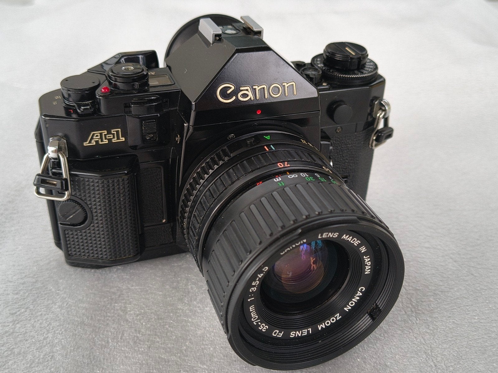 canon A-1 met 35-70mm zoomlens, Audio, Tv en Foto, Fotocamera's Analoog, Ophalen of Verzenden, Canon