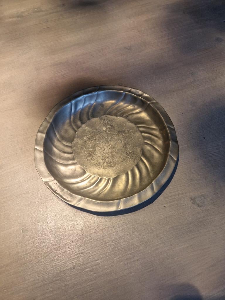 Tinnen schotel, Ophalen
