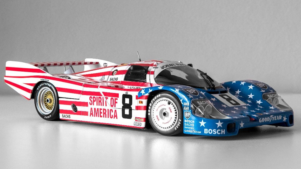 Porsche 956L Spirit of America 1/18 Minichamps, Enlèvement ou Envoi, Comme neuf, Voiture, MiniChamps