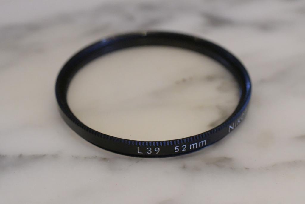 Nikon L39 UV filter 52mm, Audio, Tv en Foto, Foto | Filters, Overige merken, Gebruikt, UV-filter, Ophalen of Verzenden