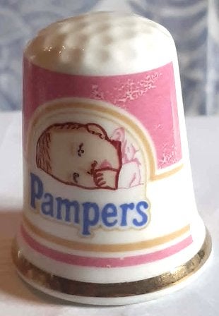 dés a coudre de collection publicitaire pampers (9), Enlèvement ou Envoi, Comme neuf, Porcelaine