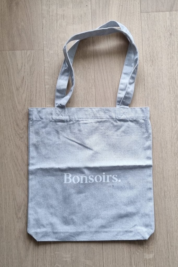Tote bag in lichtgrijs met opschrift Bonsoirs in wit, Ophalen of Verzenden, Nieuw, Grijs