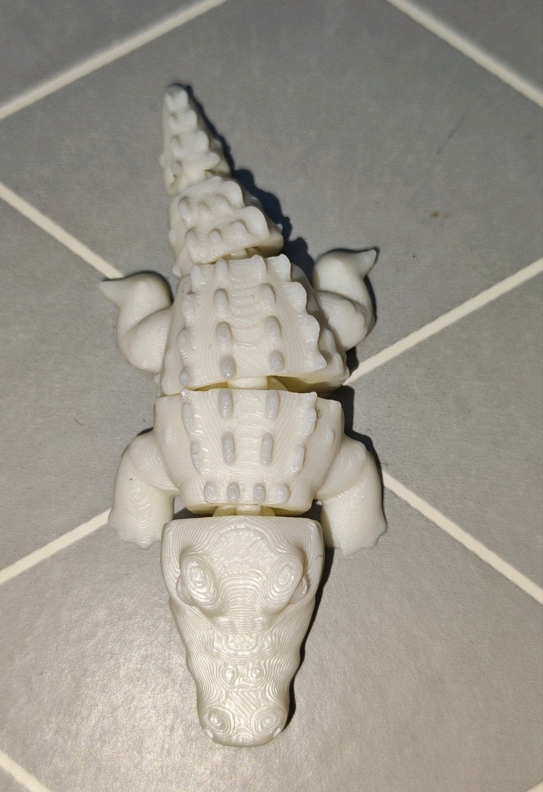 Bewegende krokodil, Ophalen