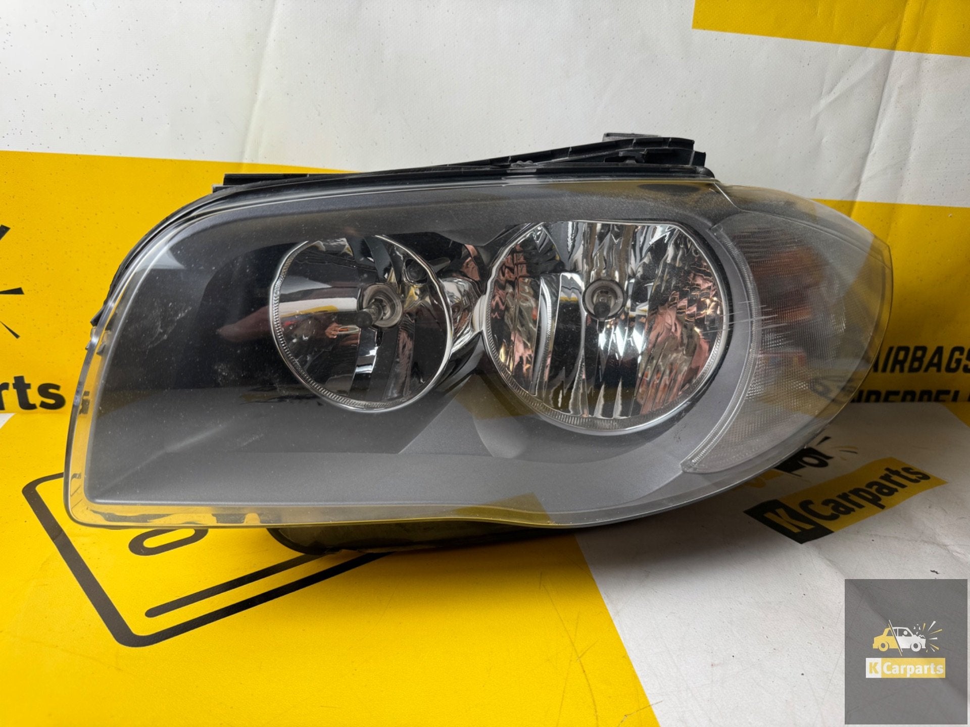 BMW 1 serie E81 E87 koplamp links origineel 69406639, Auto-onderdelen, Verlichting, Info@fabrikant.eu, Fabrikantstraat 1
1000 AA  Amsterdam, NL
