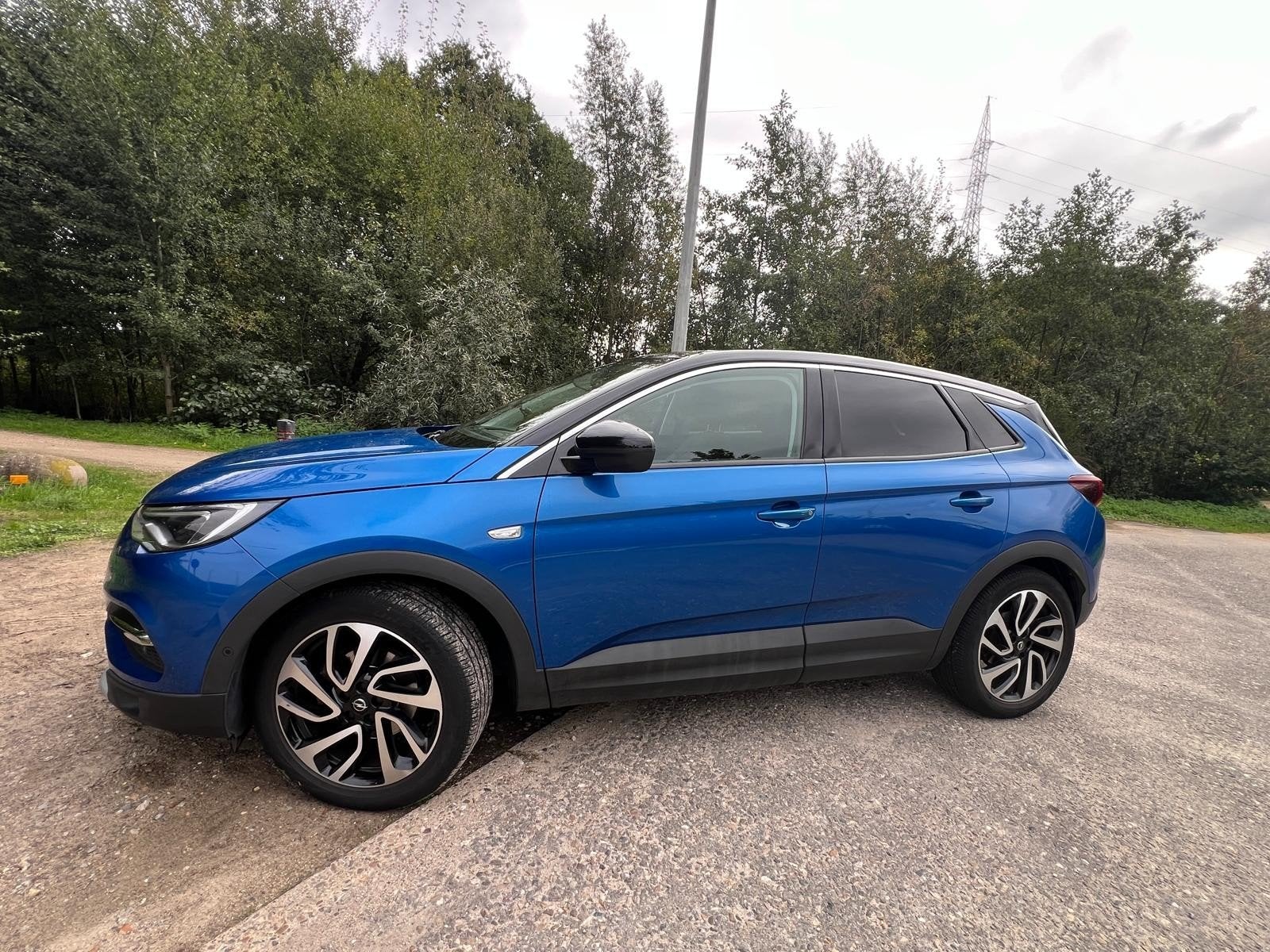 Opel Grandland X 1.2 Full Option 2019, Auto's, Automaat, Adaptieve lichten, Zwart, Blauw
