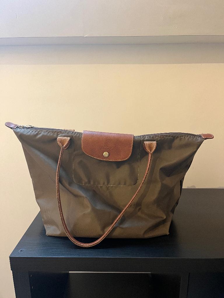 Le pliage longchamp, Ophalen, Gebruikt