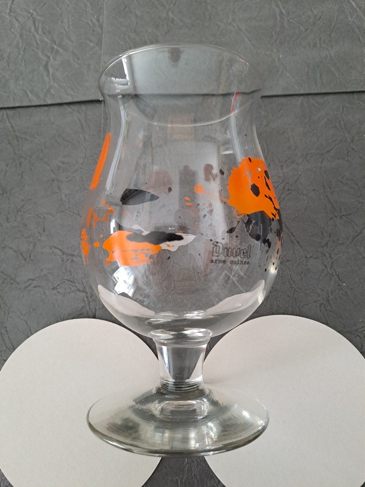 Duvel moortgat glas Arne Quinze, Verzamelen, Glas en Drinkglazen, Ophalen of Verzenden