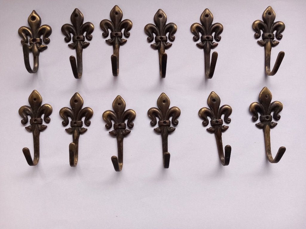 12 patères vintage en laiton avec lys, Antiquités & Art, Enlèvement ou Envoi, Cuivre