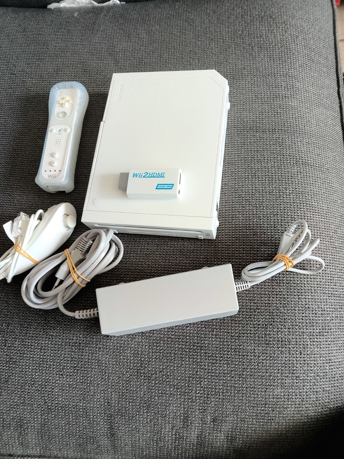 Wii console met remote controller en nunchuk, Games en Spelcomputers, Spelcomputers | Nintendo Wii, Verzenden, Zo goed als nieuw