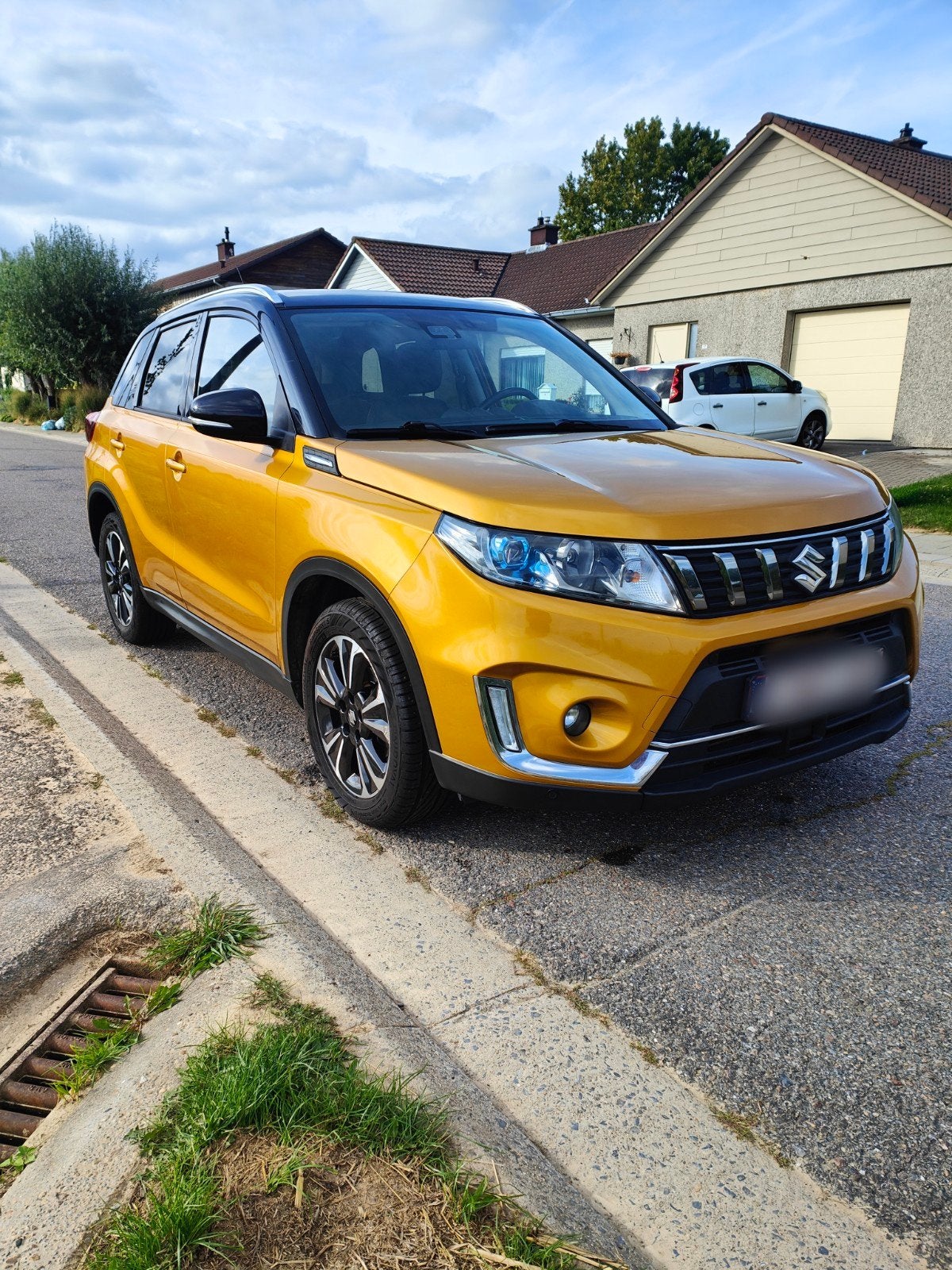 Vitara 1.4 Turbo Boosterjet Grand Luxe - Automatique, Auto's, Dealer onderhouden, 4 cilinders, Leder en Stof, Geel