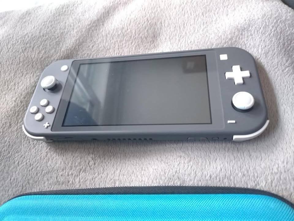 Switch Lite grise, Ophalen, Grijs, Zo goed als nieuw, Met beschermhoes of tas