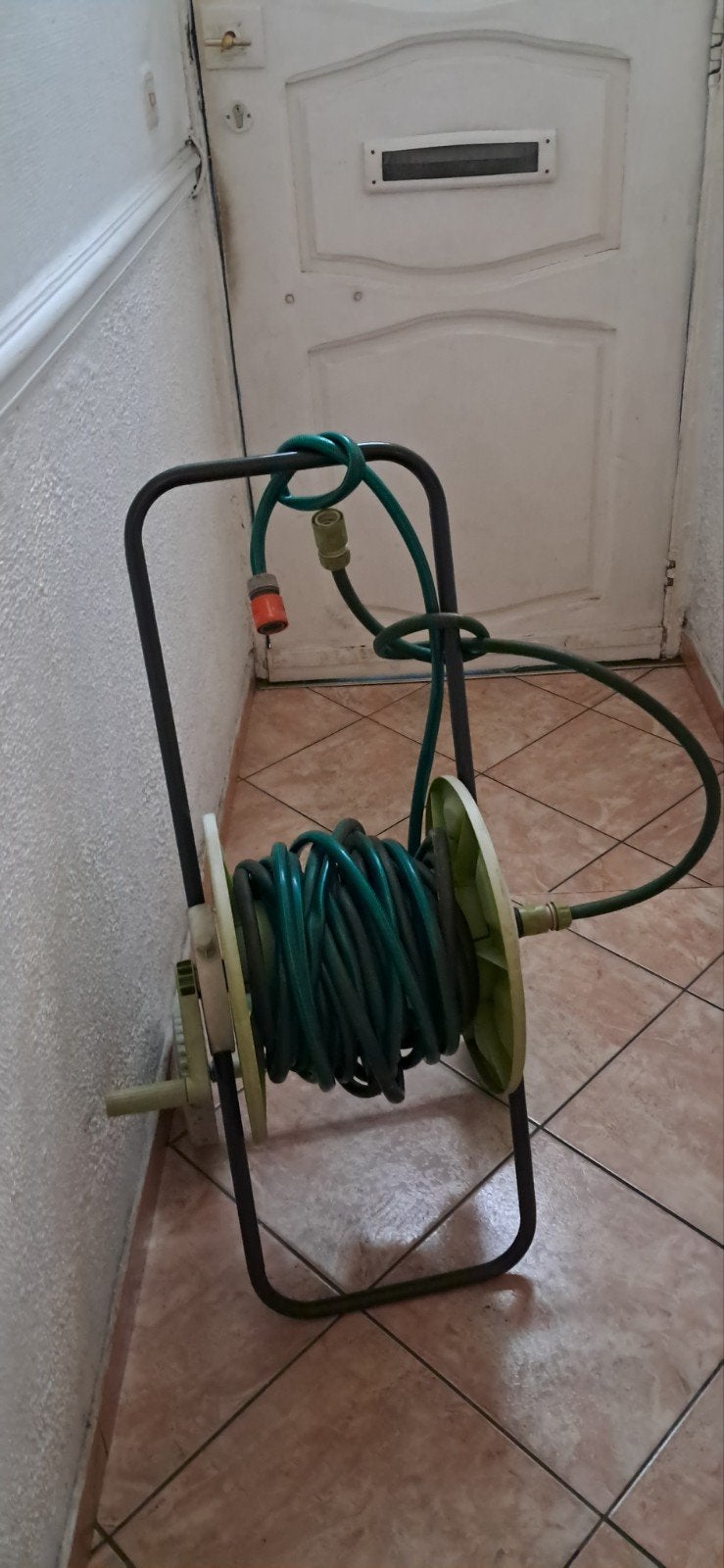 Haspel met 20 meter slang, Ophalen