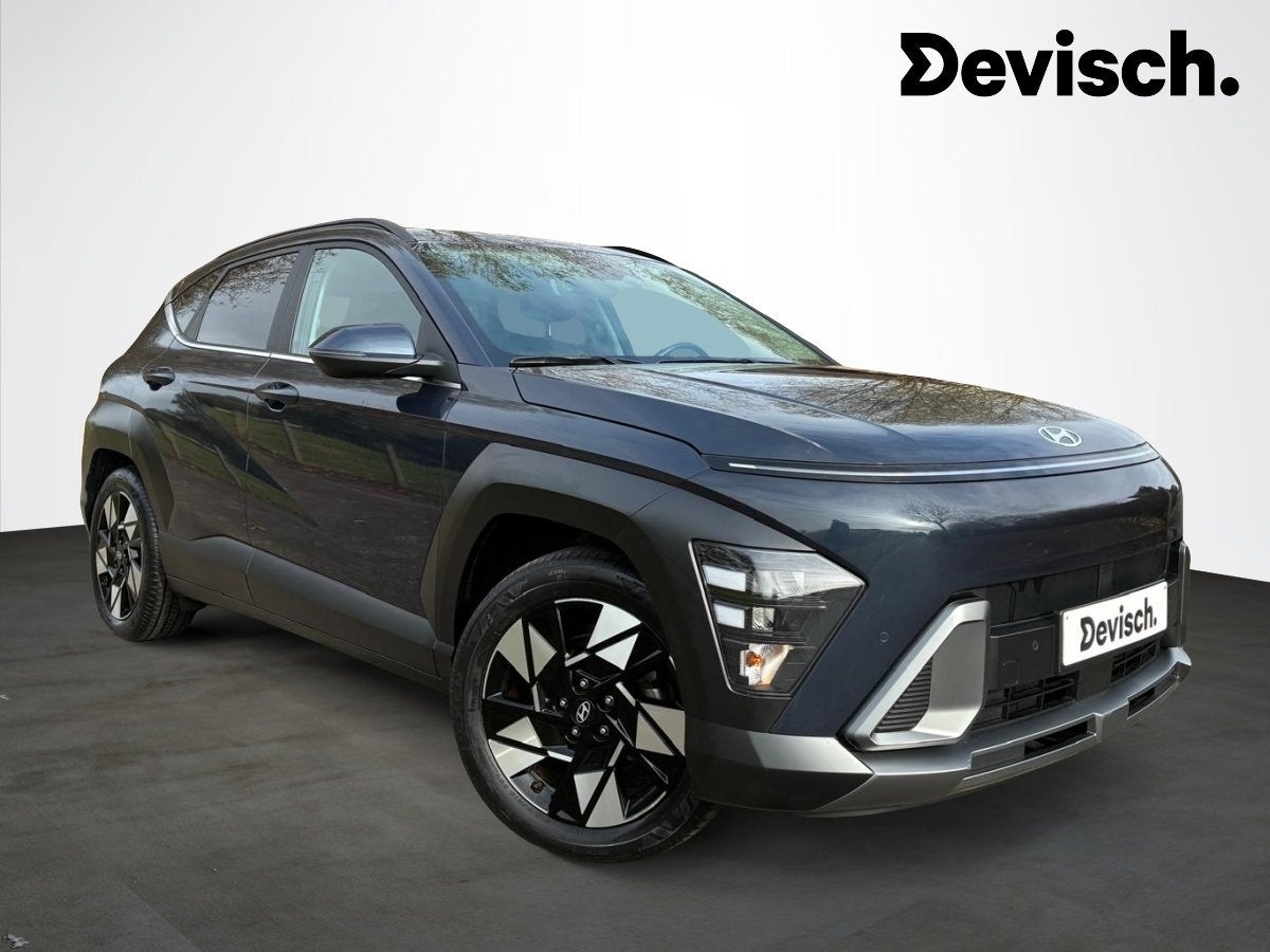 Hyundai KONA HEV 1.6 GDi DCT FEEL COMFORT 141 D6 (bj 2023), Auto's, Gebruikt, Zwart, 4 cilinders, Blauw