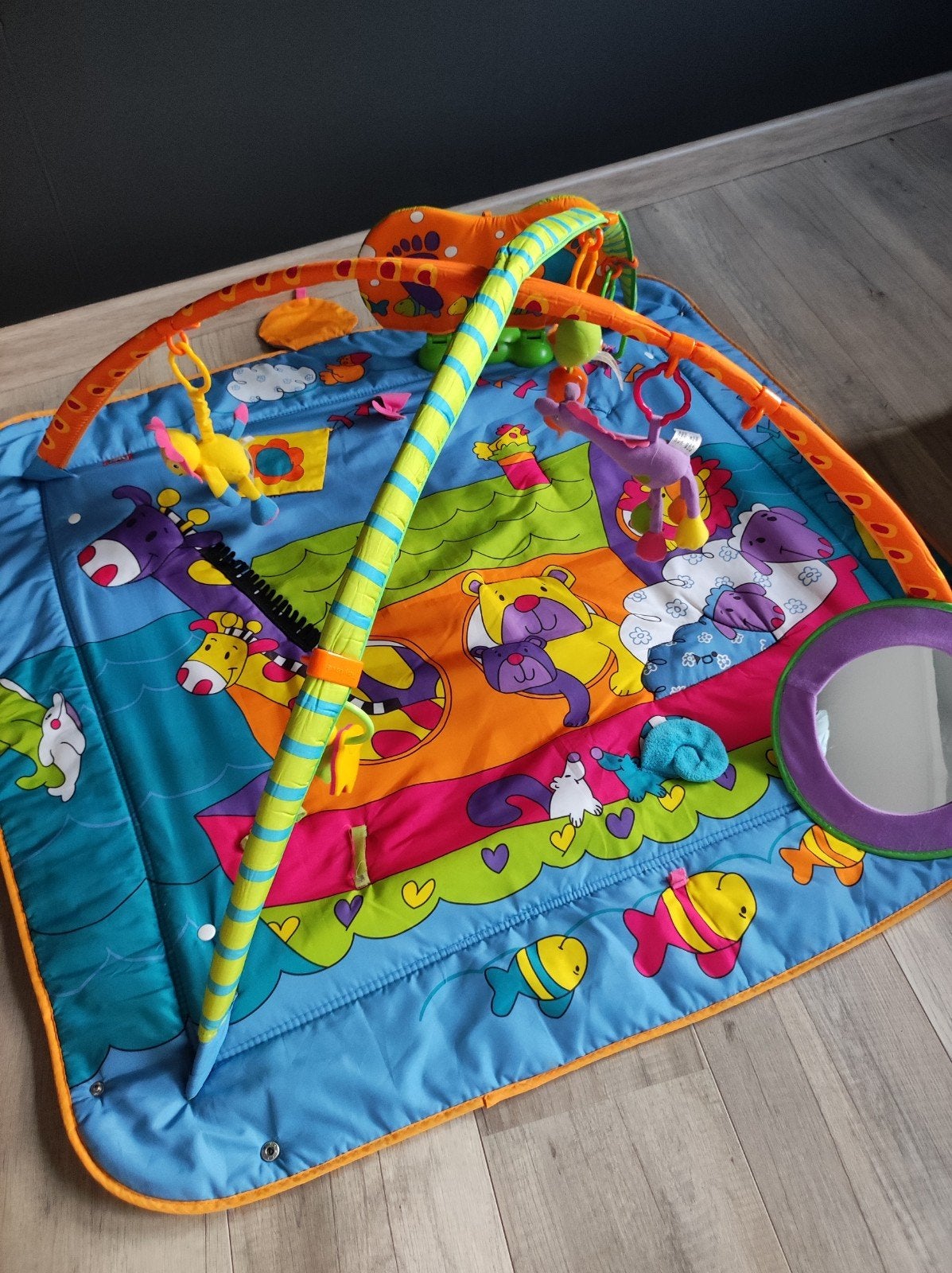 speelmat Tinylove met speelboog, Enlèvement