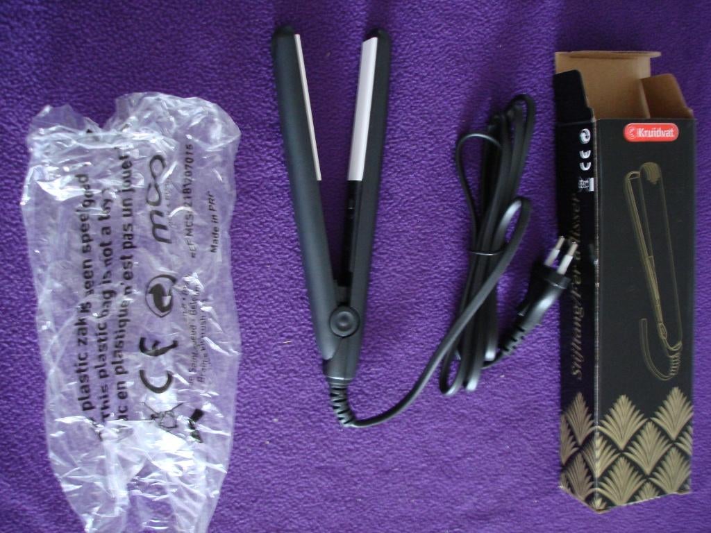 Stijltang Kruidvat nog nooit gebruikt dus nog splinternieuw., Bijoux, Sacs & Beauté, Enlèvement ou Envoi, Neuf, Fer à friser ou Lisseur