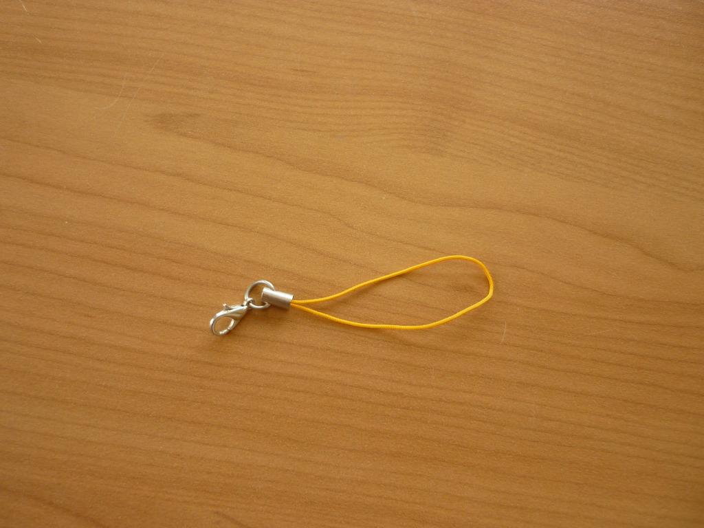 Gratis Oranje gele GSM hanger, Ophalen of Verzenden, Oranje