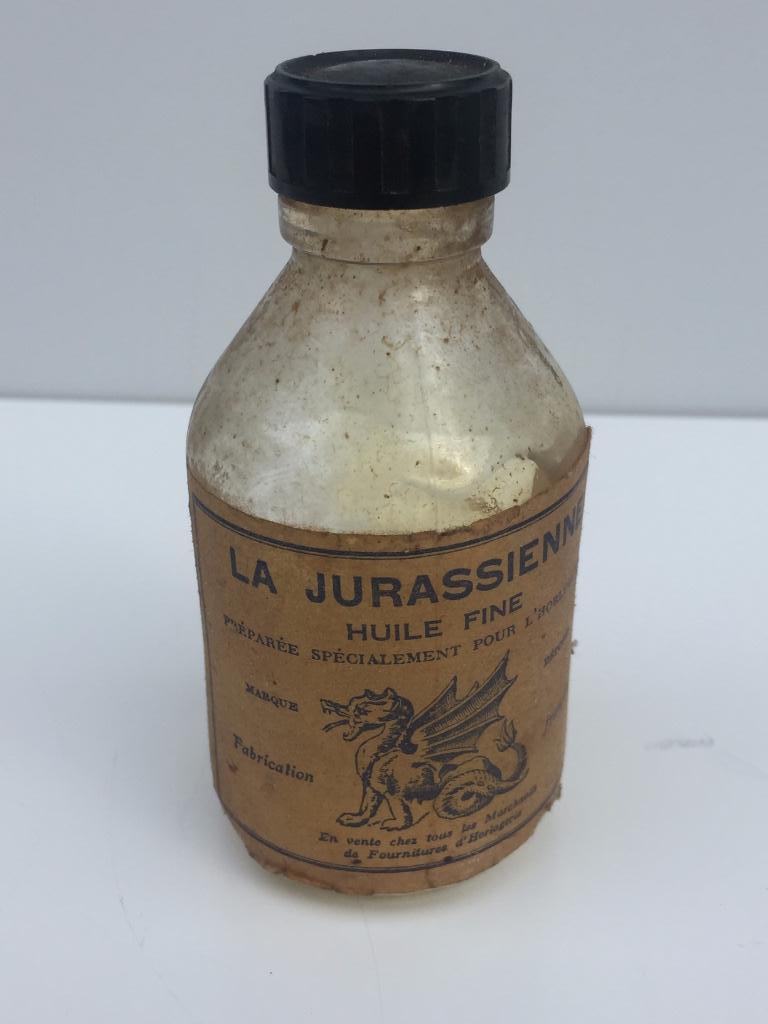 La Jurassienne huile fine pour montres, flacon 95 mm H, Antiquités & Art, Curiosités & Brocante, Enlèvement ou Envoi