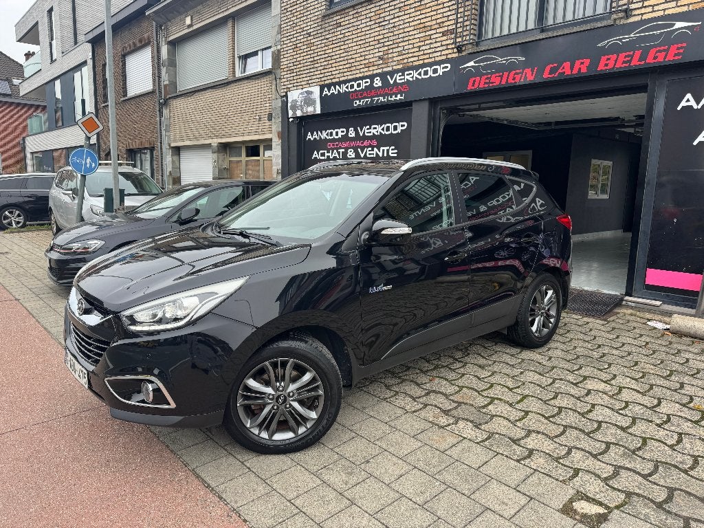 Hyundai iX35 4x2 1.6 GDi 134 ch Cosmo 1ère main Navigation, Autos, Euro 5, Entreprise, Noir, 5 portes