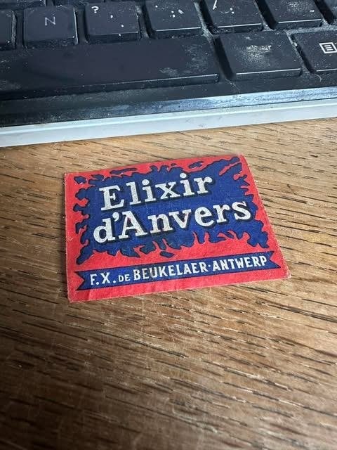 luciferdoos etiket label elixir d'Anvers F.X. De Beukelaer, Verzamelen, Gebruikt, De beukelaer, Ophalen of Verzenden, Info@debeeuce.an
