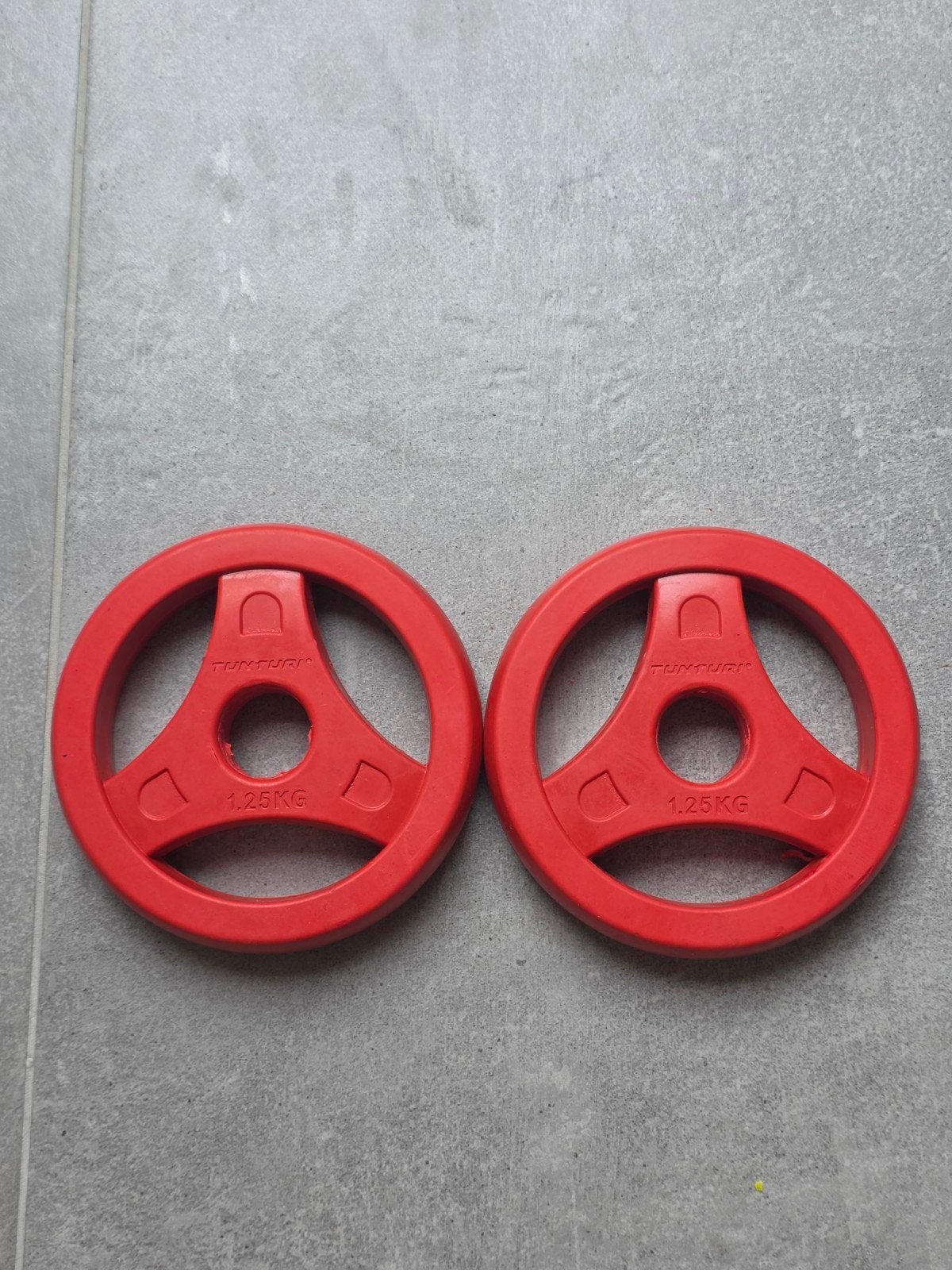 NIEUW — 2x Tunturi Aerobic schijven van 1,25 kg — Rubber, Sport en Fitness, Fitnessmaterialen, Ophalen of Verzenden, Nieuw, Benen