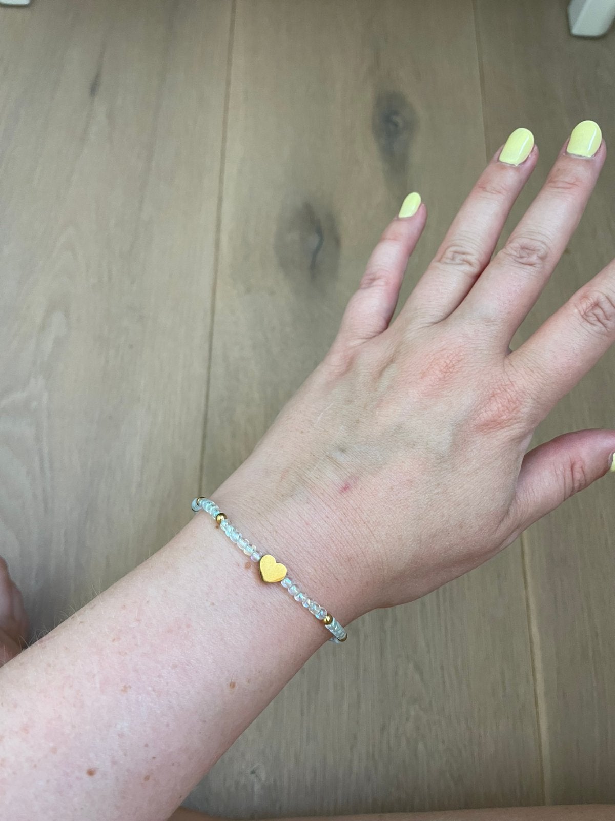 Armbandje, Ophalen of Verzenden, Zo goed als nieuw, Elastiek, Met bedels of kralen
