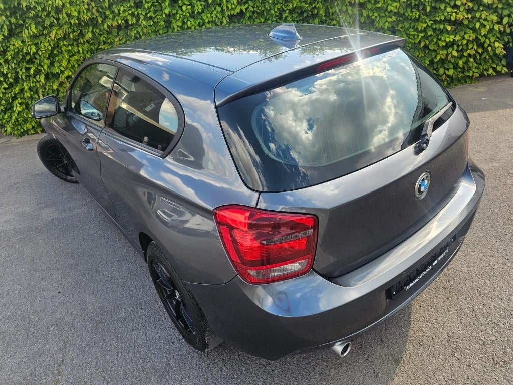 Bmw 1serie 116d checkered flag edition | handgeschakeld, Euro 5, Zwart, Navigatiesysteem, https://public.car-pass.be/vhr/e65ff86b-fbcf-4c30-a782-fe79bf45bf71