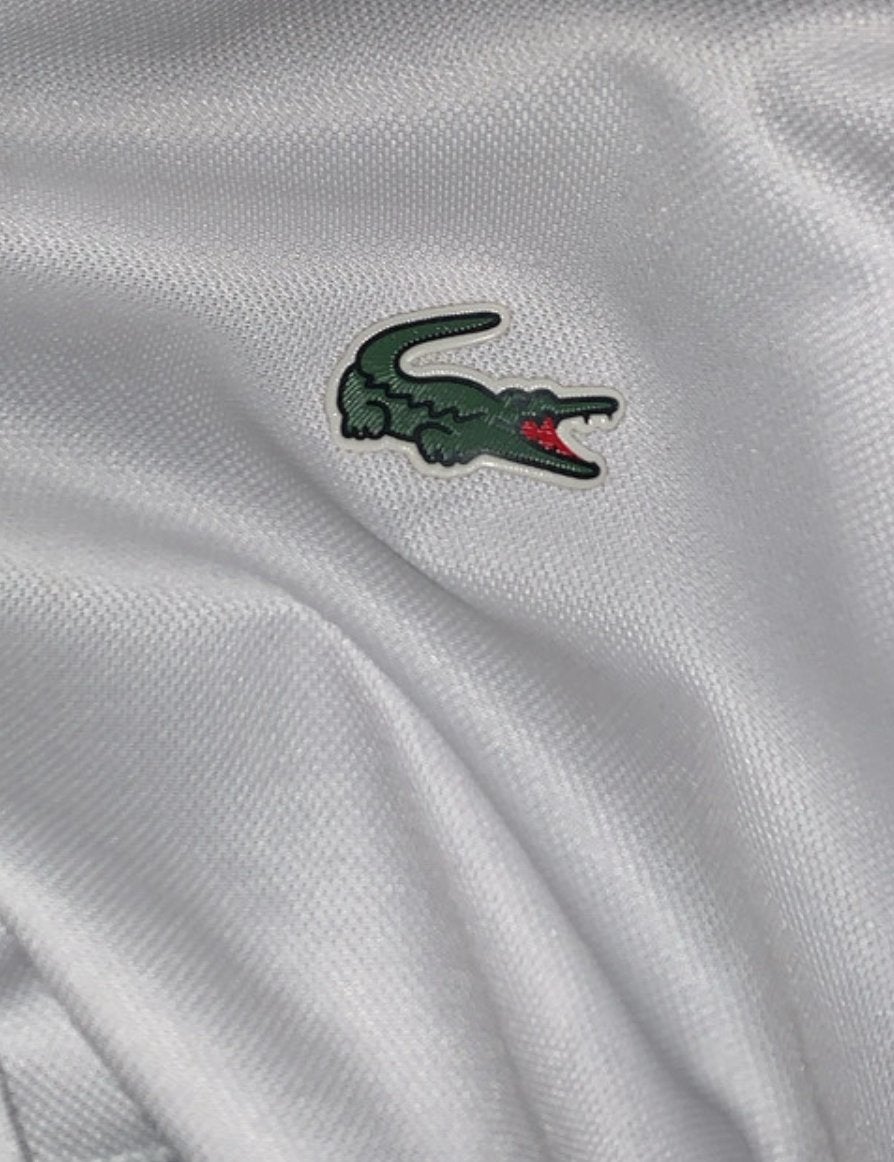 Ensemble Lacoste sure liege a veninr chercher, Enlèvement ou Envoi, Comme neuf, Taille 48/50 (M), Blanc