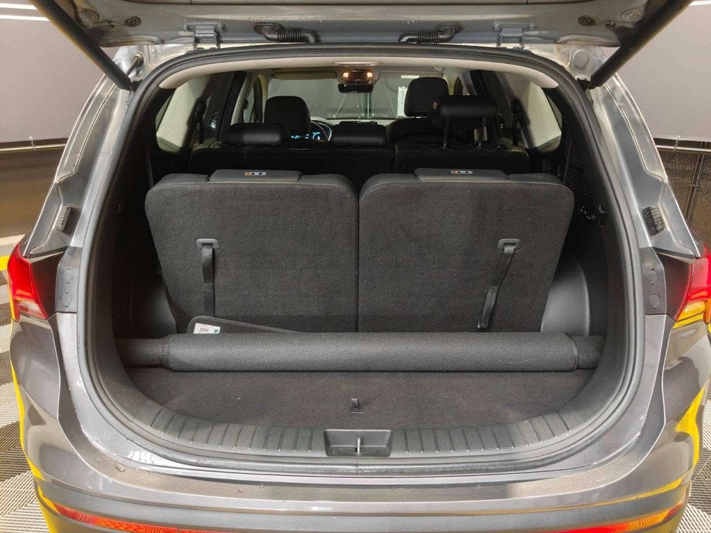 Hyundai Santa Fe 1.6 HEV T-GDi 180pk 7-zit/MemoryLeder/AdCru, Auto's, Hyundai, Santa Fe, Zwart, 4 cilinders, Sound system