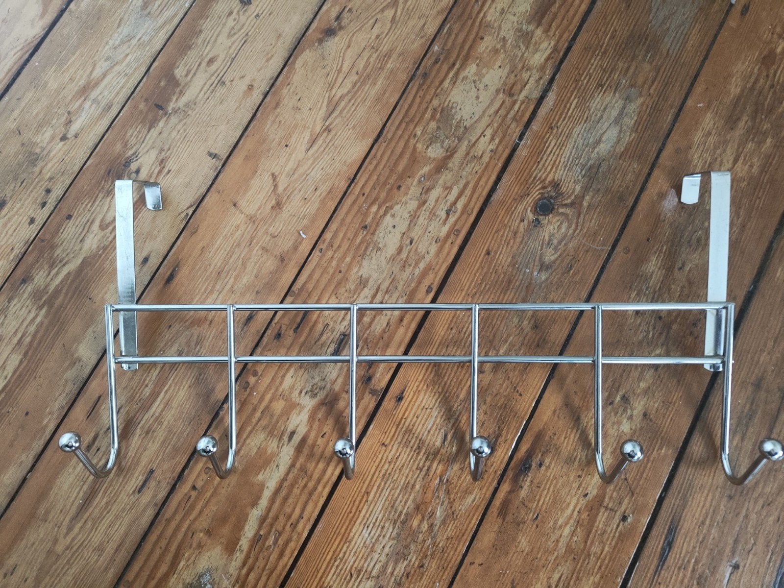 Kapstok voor aan de deur, Ophalen
