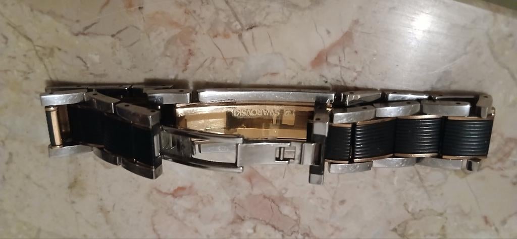 Swarovski herenarmband, Ophalen