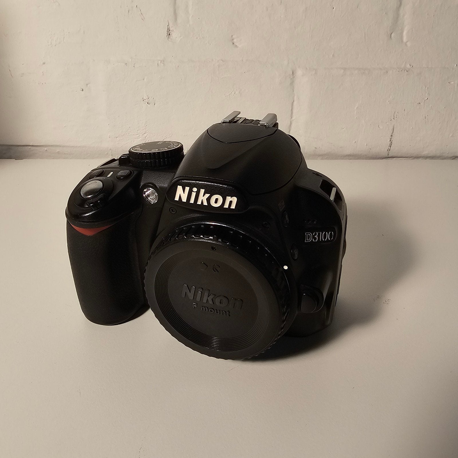 Nikon D3100 incl lader en ac.cu, Ophalen of Verzenden, Oplader, Nikon