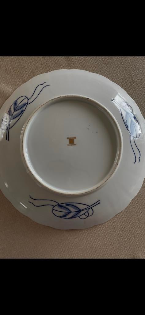 Chinese schotel met stempel, Ophalen