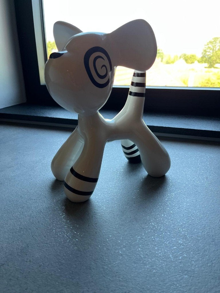 stenen hondje beeldje, Ophalen