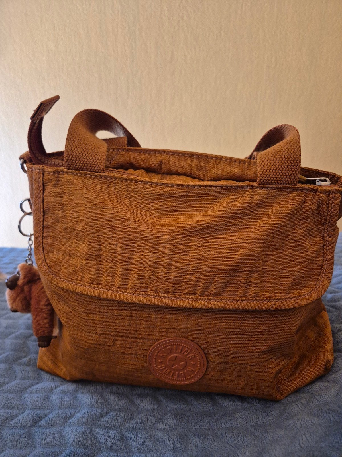 kipling handtas, Ophalen
