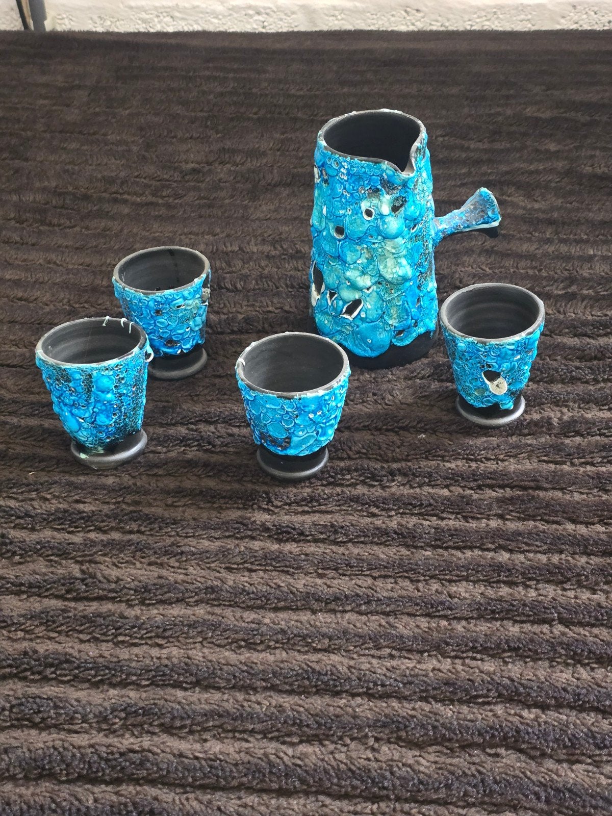 poterie rétro (glaçure goutte à goutte), Enlèvement