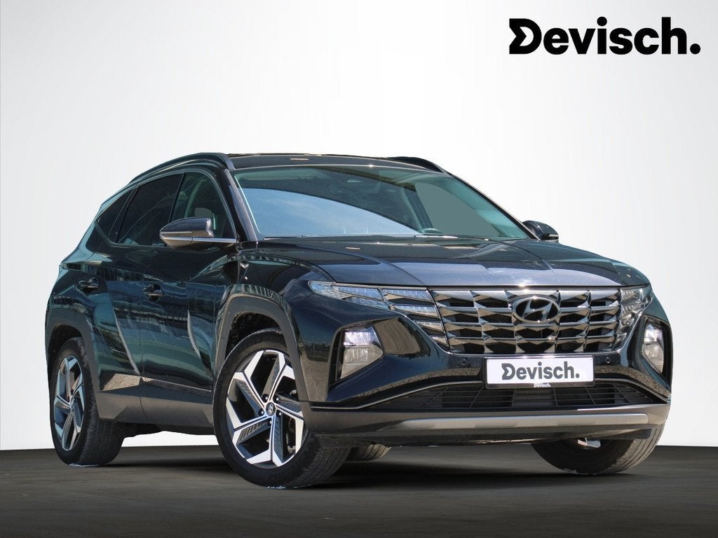 Hyundai Tucson Hybrid 1.6T Feel Comfort 230PK *LEDER*TREKHAA, Auto's, Gebruikt, 4 cilinders, Zwart, Leder