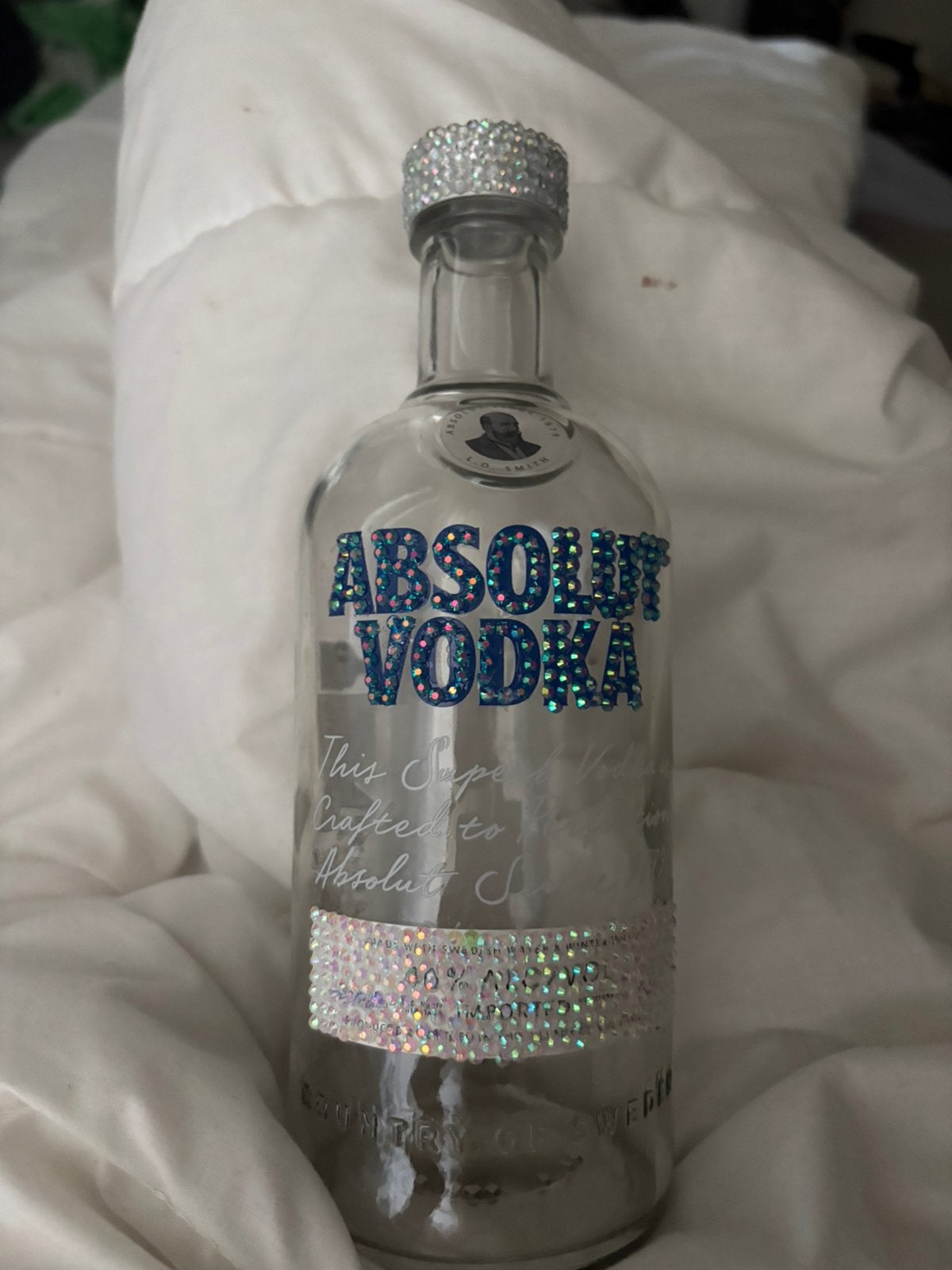 Bedazzelde vodka fles (zonder drank in), Ophalen