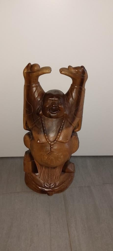 Houten boeddha, Ophalen
