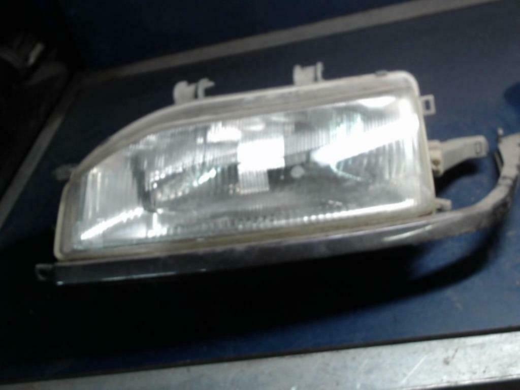 optique avant principal gauche Honda Concerto 1.6cc 1994, Enlèvement, Utilisé, Honda