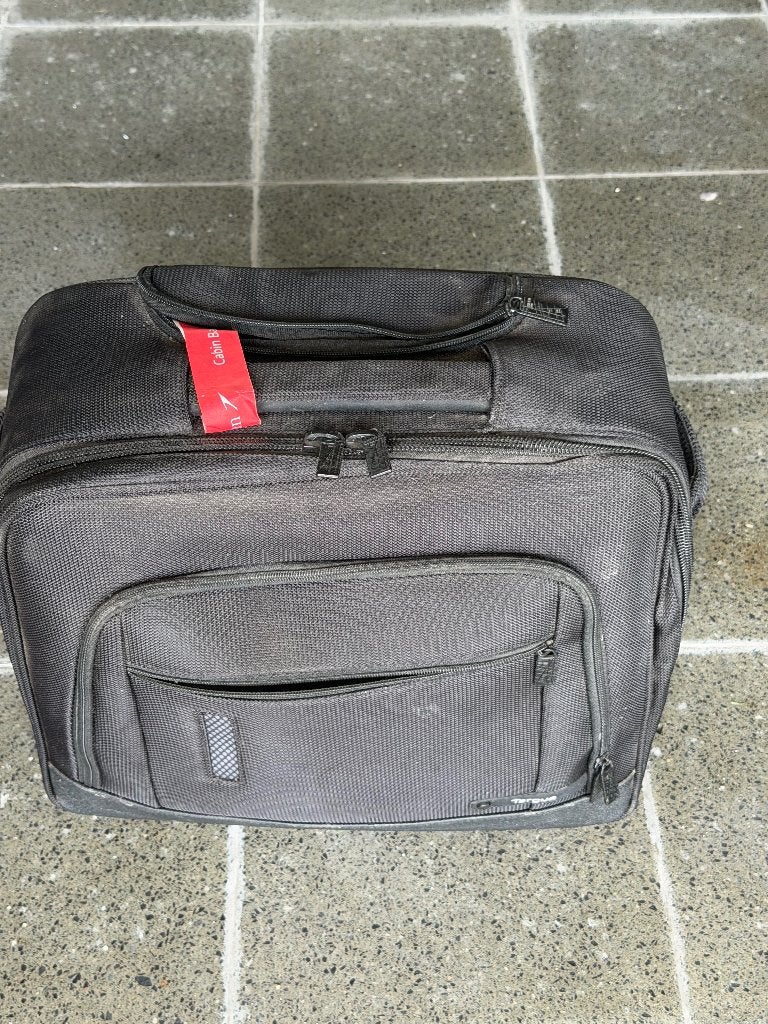 Boekentas op wieltjes en handvat, Ophalen, Gebruikt