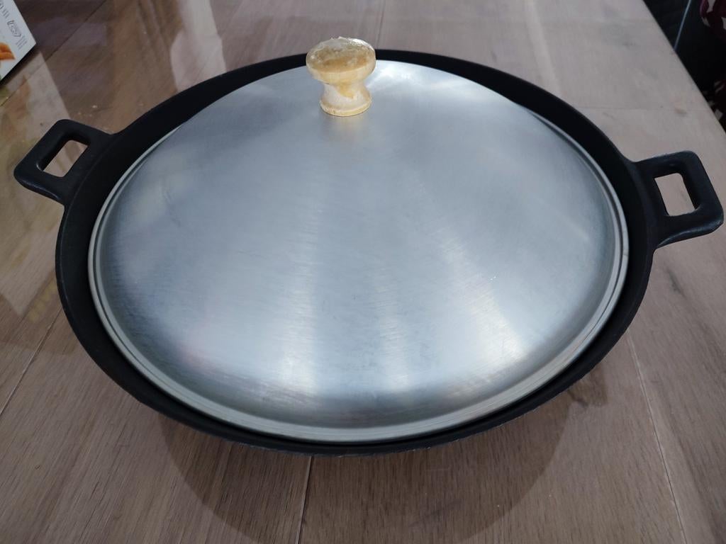 Wok en fonte, Enlèvement, Fonte, Wok