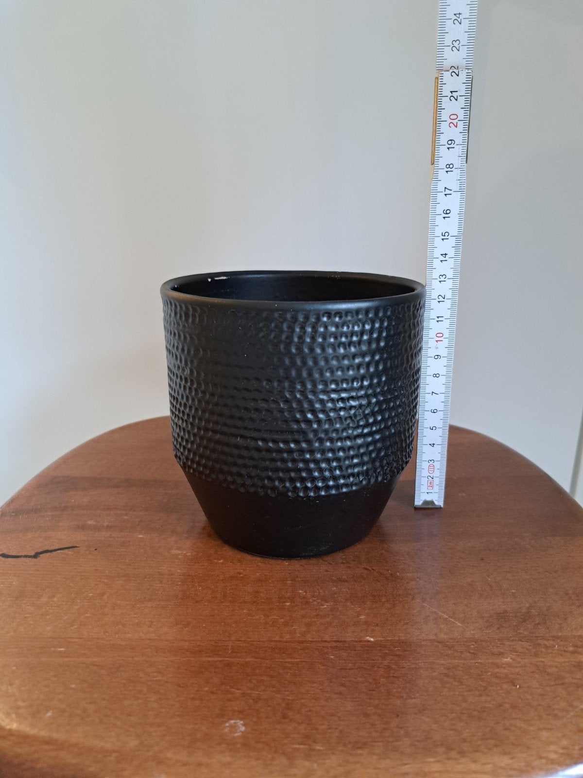 zwarte stenen bloempot, Ophalen
