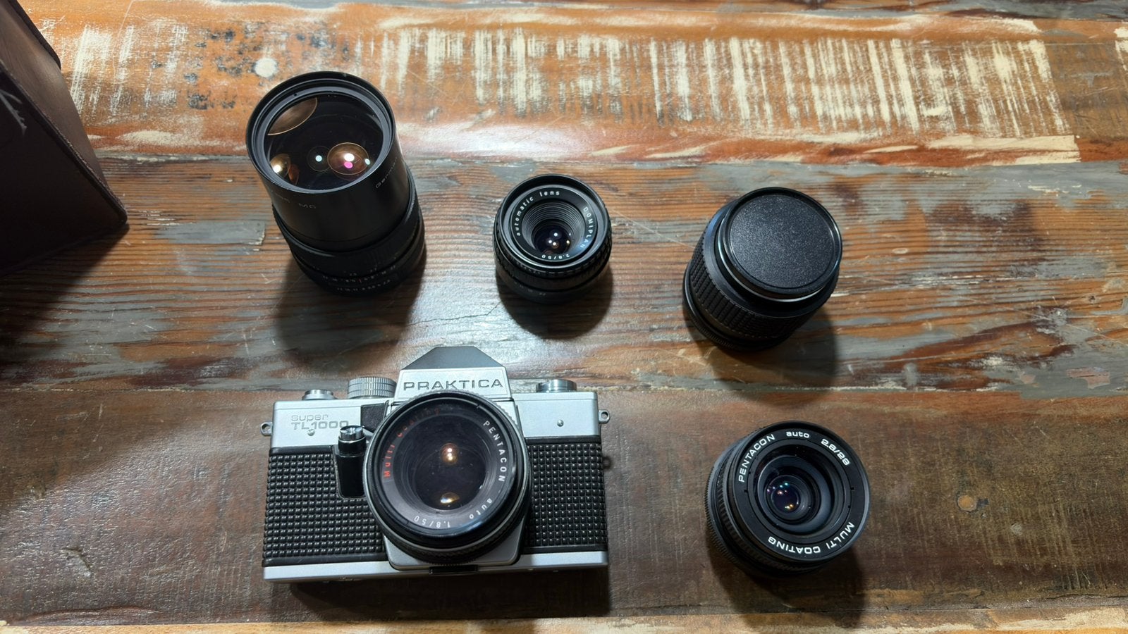Praktica Super TL1000Kit complet d’appareil photo argentique, TV, Hi-fi & Vidéo, Appareils photo analogiques, Comme neuf, Enlèvement ou Envoi