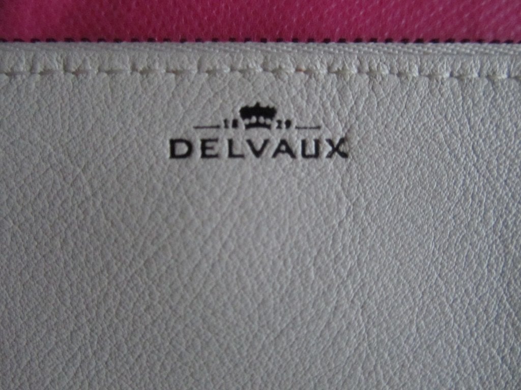 DELVAUX Lot pochette portefeuille + porte clé siglé, Envoi