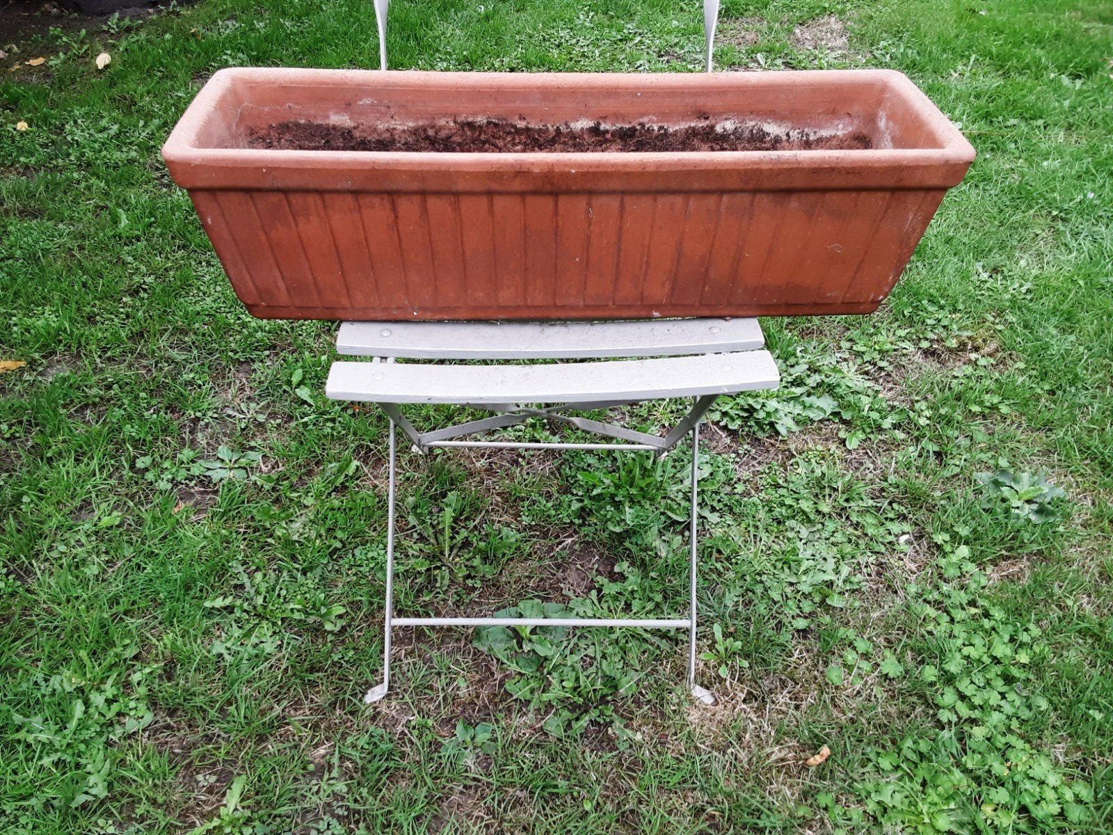stenen bloembak, Ophalen