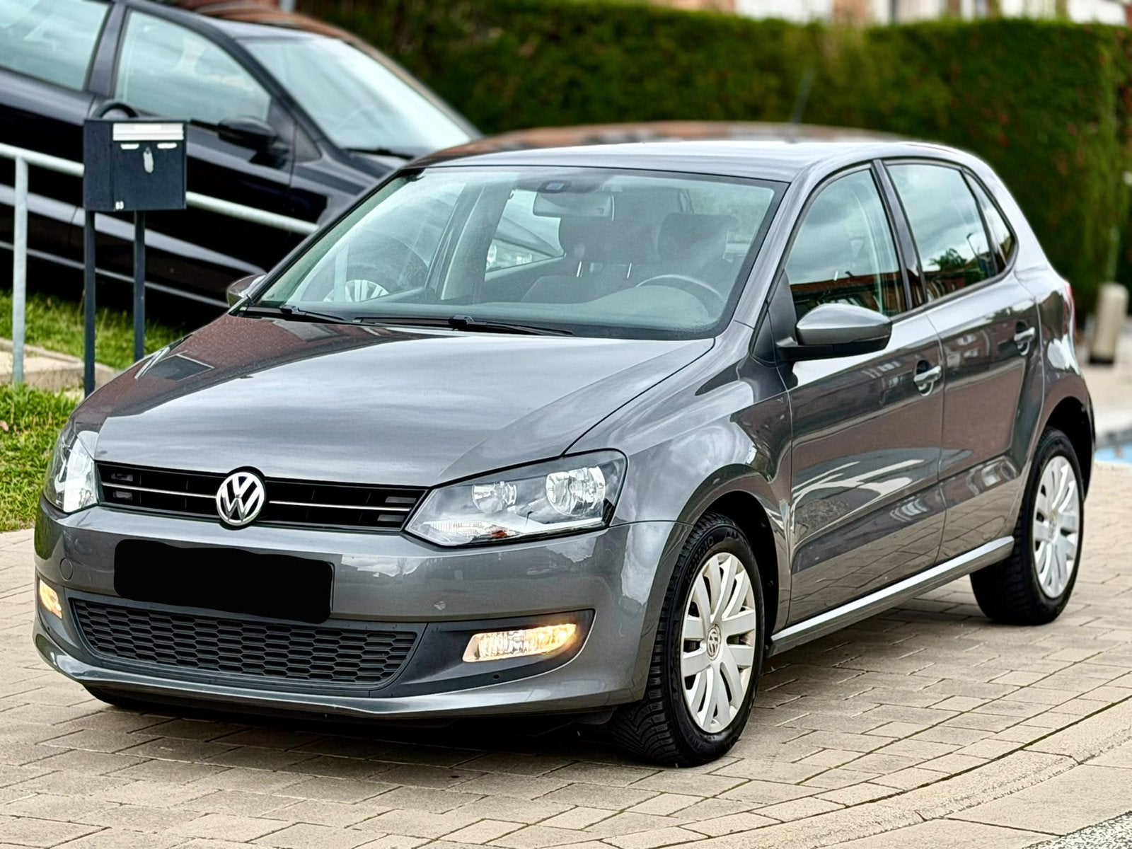 VOLKSWAGEN POLO 1.2 • PARKEERSENS • VOL ONDERSHIS. • CARPLAY, Auto's, Voorwielaandrijving, Stof, Zwart, Verwarmde buitenspiegels