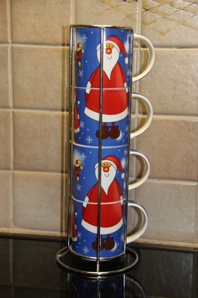 4 kersttassen in houder, Ophalen of Verzenden, Zo goed als nieuw, Kop(pen) en/of Schotel(s)