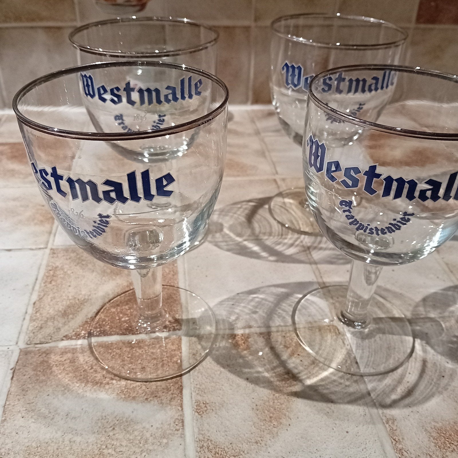 11 glazen Westmalle blauwe letters, Verzamelen, Ophalen, Zo goed als nieuw