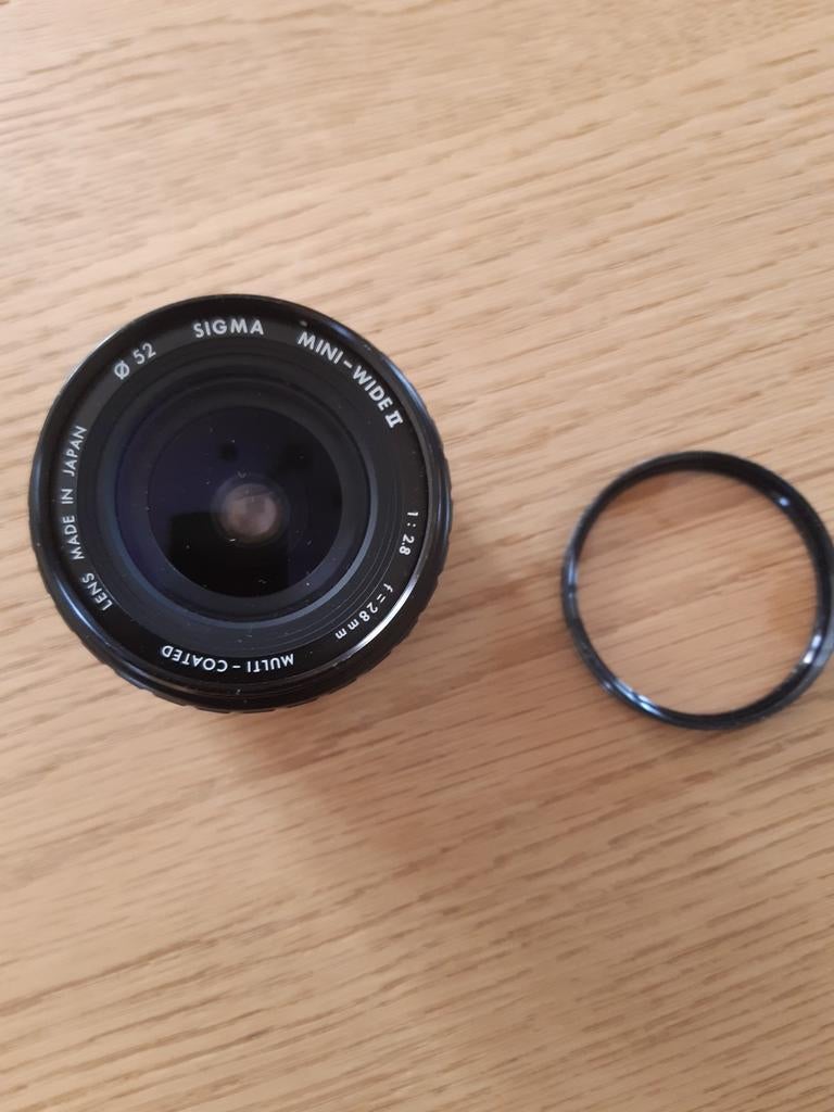 Lens Sigma met skylight filter, Audio, Tv en Foto, Ophalen of Verzenden, Gebruikt